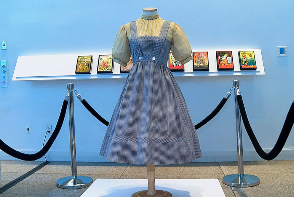 PHOTO: A blue and white checked gingham dress, worn by Judy Garland in the "Wizard of Oz," hangs on display at Bonhams in New York, April 25, 2022