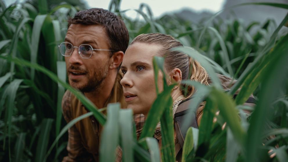 PHOTO: Jonathan Bailey as paleontologist Dr. Henry Loomis and Scarlett Johansson as skilled covert operations expert Zora Bennett in "Jurassic World Rebirth," 2024. 