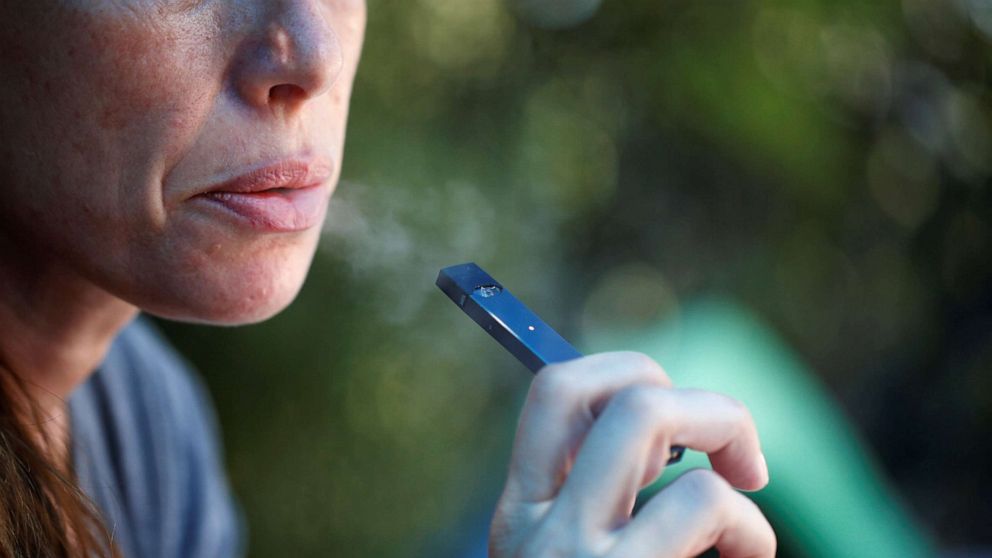 PHOTO: A woman smokes a Juul e-cigarette in this posed picture, Sept. 16, 2018.