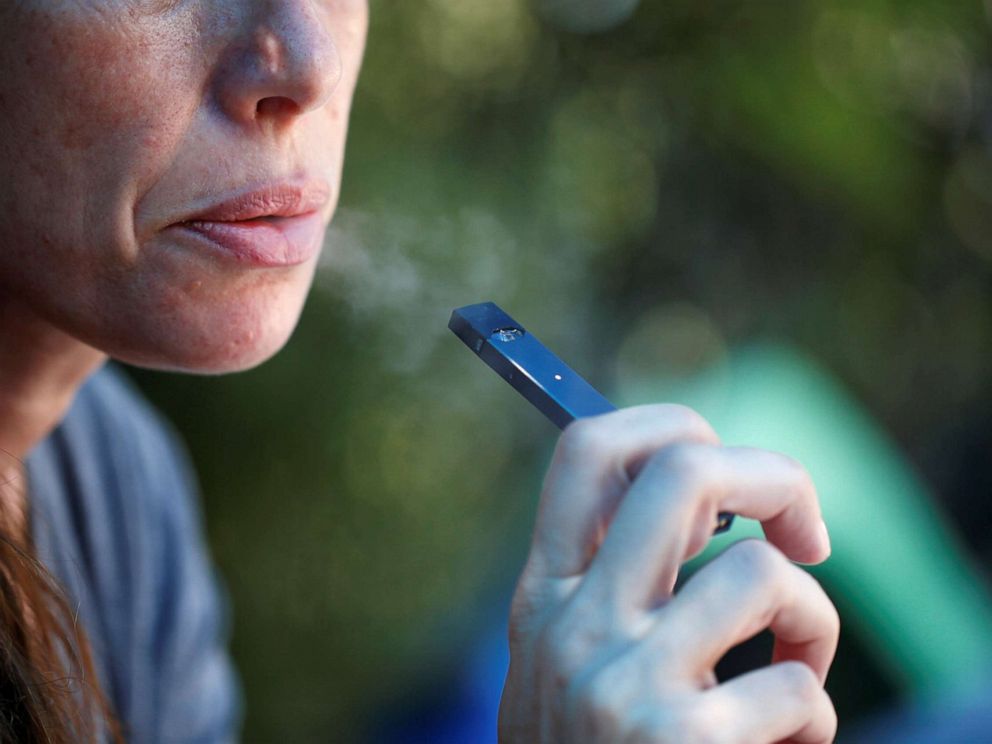 PHOTO: A woman smokes a Juul e-cigarette in this posed picture, Sept. 16, 2018.