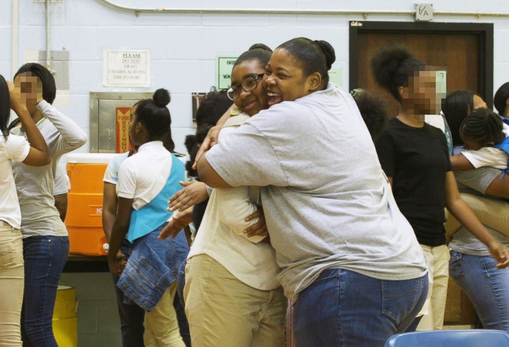 PHOTO: Kamisha Loftin hugs her daughter D'Amoni Loftin during a Girl Scouts meeting at the Maryland Correctional Institution for Women in Jessup, Md., in September 2018.