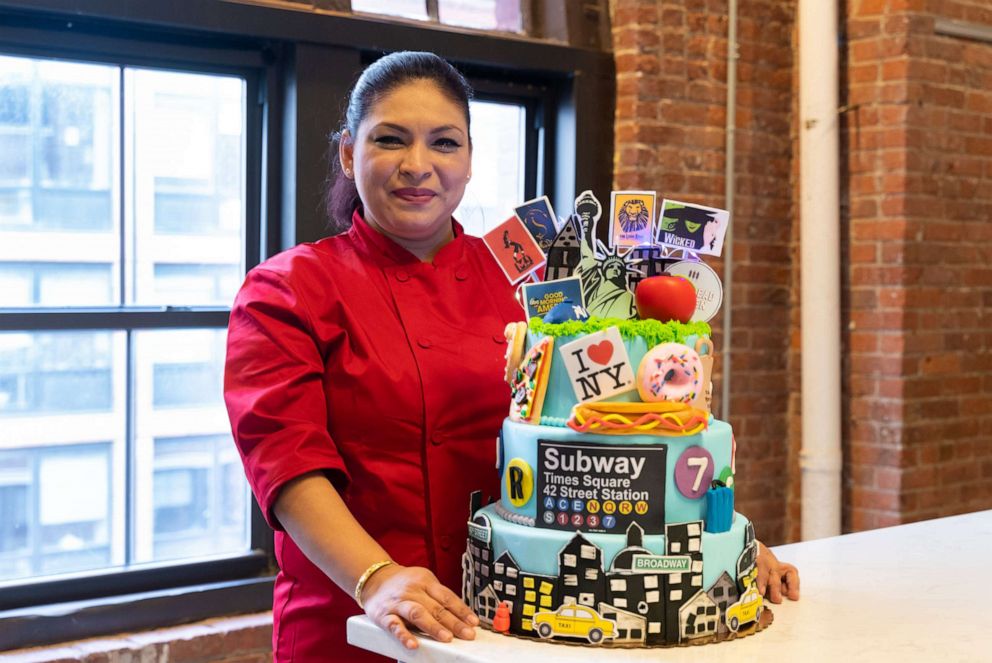 PHOTO: Kandy Alva at the Hot Bread Kitchen headquarters with a homemade cake inspired by New York City.