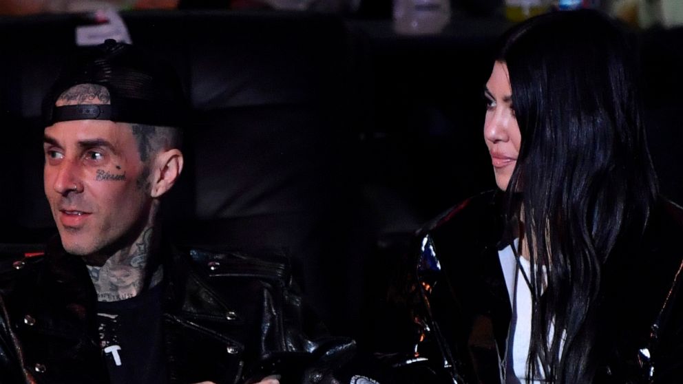PHOTO: Travis Barker and Kourtney Kardashian are seen during the UFC 260 event at UFC APEX on March 27, 2021 in Las Vegas.