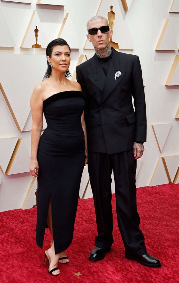 PHOTO: Kourtney Kardashian and Travis Barker pose on the red carpet during the Oscars arrivals at the 94th Academy Awards in Hollywood, Calif., March 27, 2022. 
