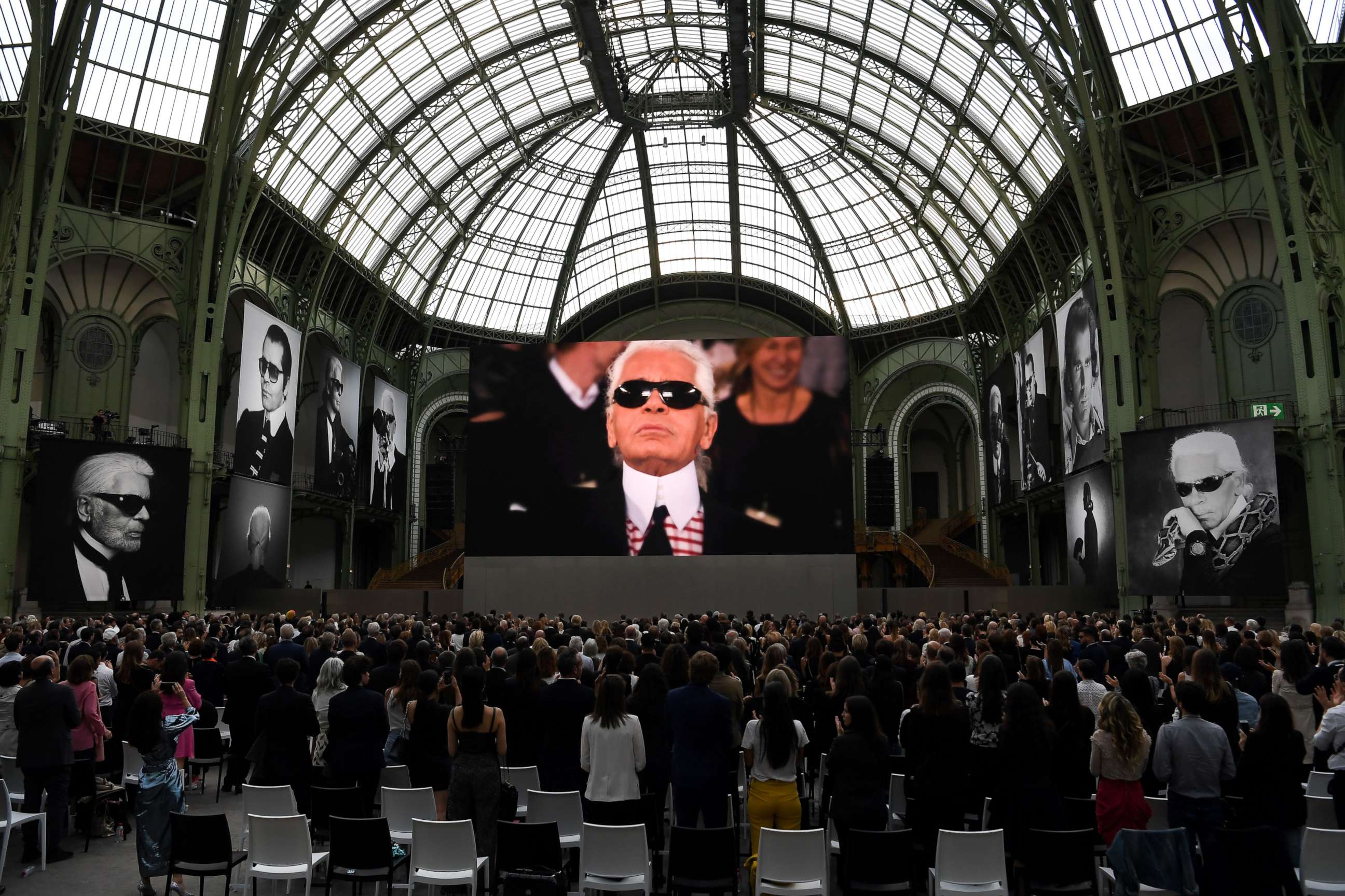 PHOTO: People attend an event to honor the late German fashion designer Karl Lagerfeld at the Grand Palais in Paris, June 20, 2019.