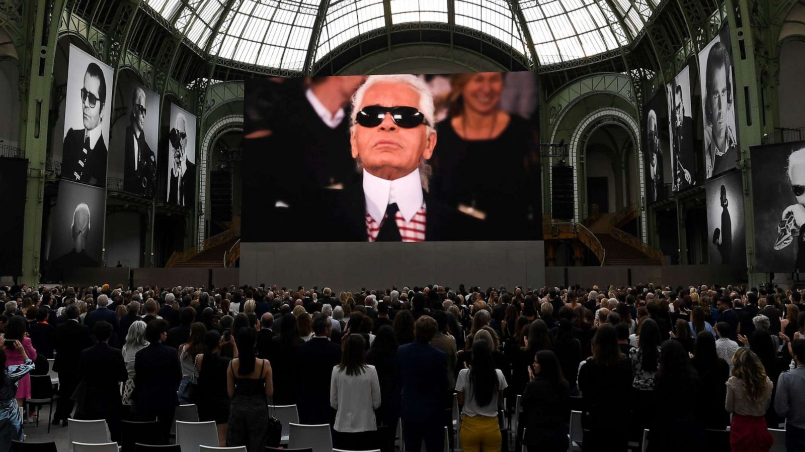 PHOTO: People attend an event to honor the late German fashion designer Karl Lagerfeld at the Grand Palais in Paris, June 20, 2019.