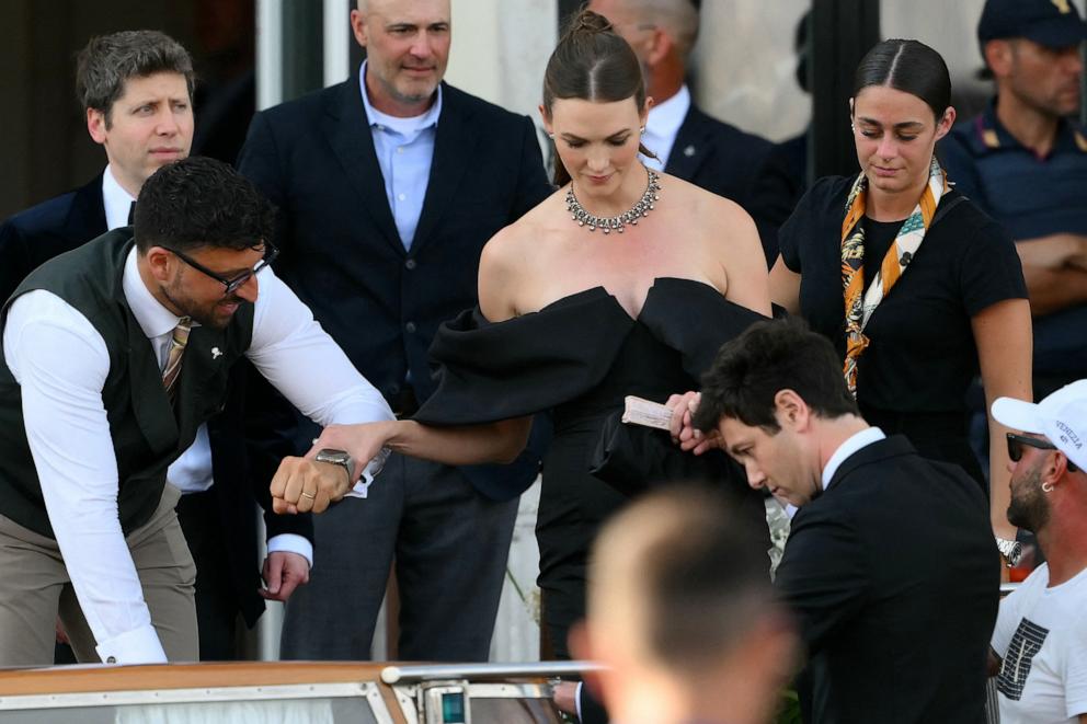PHOTO: Sam Altman and Karlie Kloss leave the St Regis Hotel on the wedding day of Amazon founder Jeff Bezos with Lauren Sanchez, in Venice, Italy, on June 27, 2025.