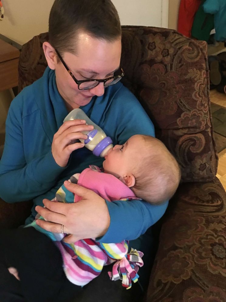 PHOTO: Kata Carter feeds her daughter, Rosie, a bottle with donated breast milk.