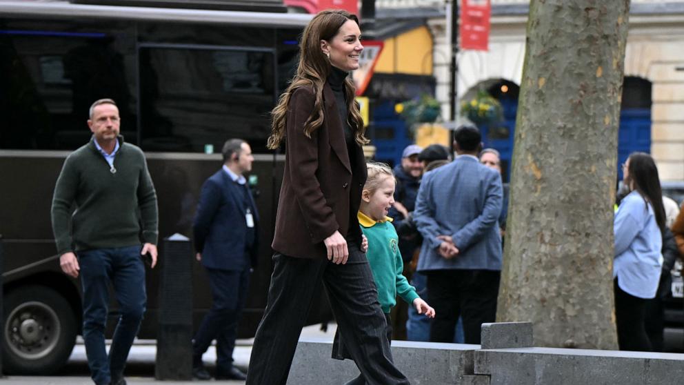 PHOTO: Britain's Catherine, Princess of Wales holds the hand of pupil from All Souls CE Primary School at the National Portrait Gallery in central London, on Feb. 4, 2025.