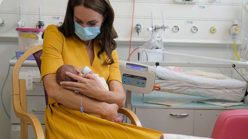 PHOTO: Kate, the Princess of Wales, cradles baby Bianca as she speaks to her mother Sylvia Novak, during a visit to the Royal Surrey County Hospital's maternity unit, in Guilford, England, Oct. 5, 2022.