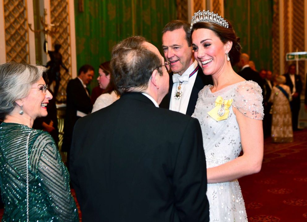 PHOTO: Britain's Catherine, The Duchess of Cambridge, talks to guests at an evening reception for members of the Diplomatic Corps at Buckingham Palace in London, Dec. 4, 2018. 