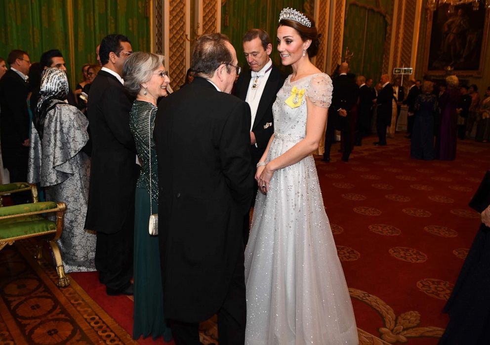 PHOTO: Catherine, Duchess of Cambridge greets guests at an evening reception for members of the Diplomatic Corps at Buckingham Palace on Dec. 4, 2018 in London.
