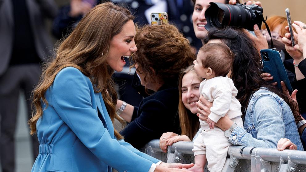 PHOTO: Britain's Catherine, Princess of Wales, interacts with a baby after visiting Reggio Emilia town hall during a two-day visit to the region, in Reggio Emilia, Italy, May 13, 2026. 