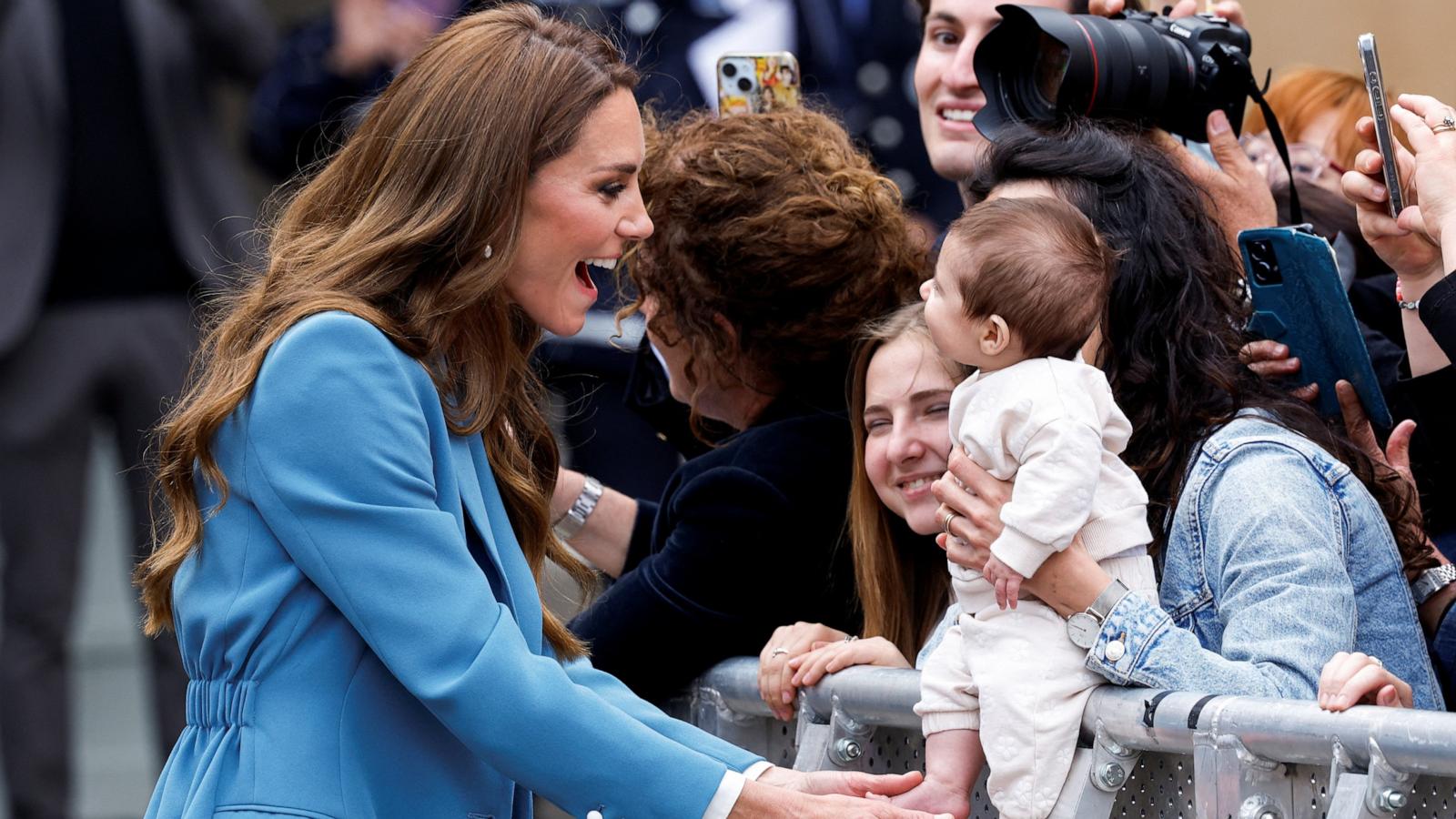 PHOTO: Britain's Catherine, Princess of Wales, interacts with a baby after visiting Reggio Emilia town hall during a two-day visit to the region, in Reggio Emilia, Italy, May 13, 2026.