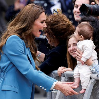 PHOTO: Britain's Catherine, Princess of Wales, interacts with a baby after visiting Reggio Emilia town hall during a two-day visit to the region, in Reggio Emilia, Italy, May 13, 2026. 