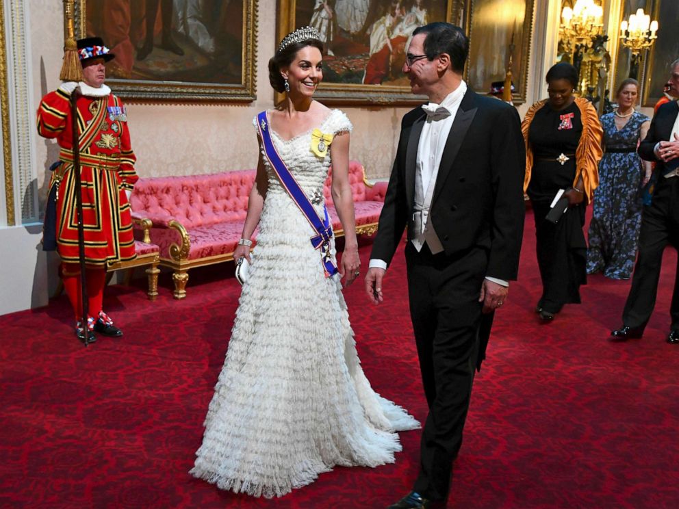 PHOTO: Kate, the Duchess of Cambridge and United States Secretary of the Treasury, Steven Mnuchin arrive through the East Gallery ahead of the State Banquet at Buckingham Palace in London, June 3, 2019. 