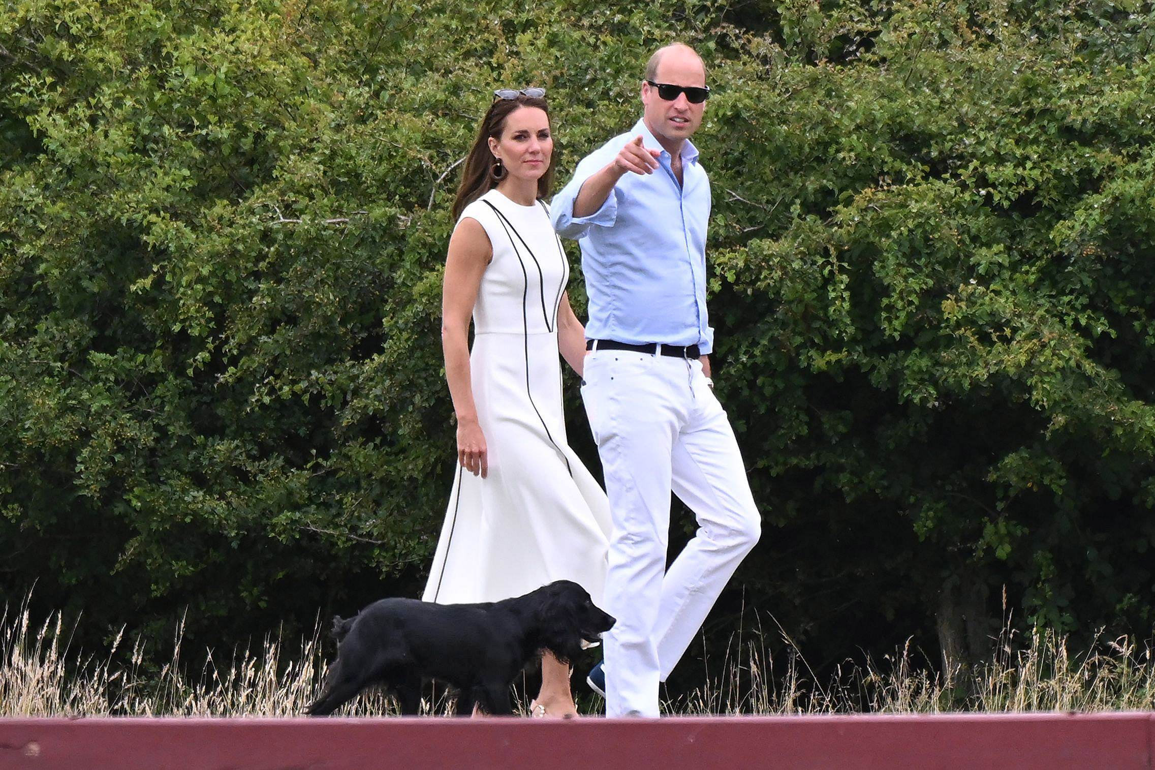 PHOTO: Catherine Duchess of Cambridge and Prince William walk their dog Orla while attending the Royal Charity Polo Cup at Guards Polo Club, Windsor, UK, July 6, 2022. The match is to raise funds and awareness for charities supported by them.