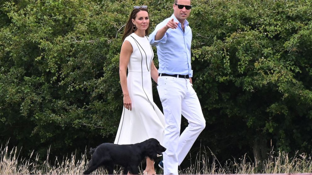 PHOTO: Catherine Duchess of Cambridge and Prince William walk their dog Orla while attending the Royal Charity Polo Cup at Guards Polo Club, Windsor, UK, July 6, 2022. The match is to raise funds and awareness for charities supported by them.