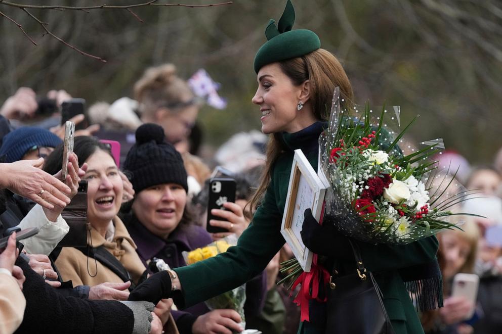 PHOTO: Kate, Princess of Wales receives flowers and gift from well-wishers after attending the Christmas day service at St Mary Magdalene Church in Sandringham in Norfolk, England, Wednesday, Dec. 25, 2024.