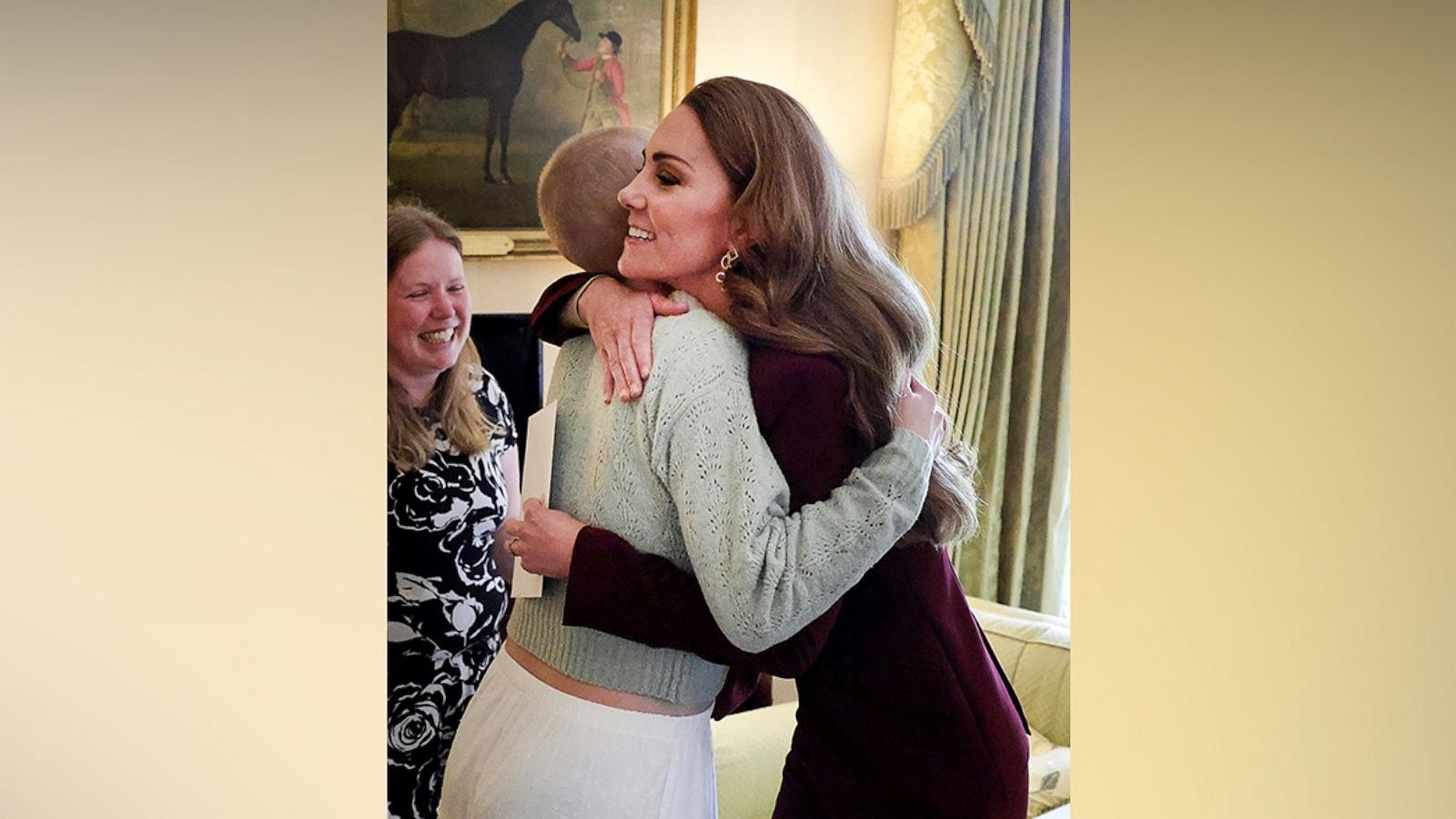 PHOTO: The Princess of Wales hugged a young fellow cancer sufferer after she was invited to Windsor Castle to take pictures by Prince William.