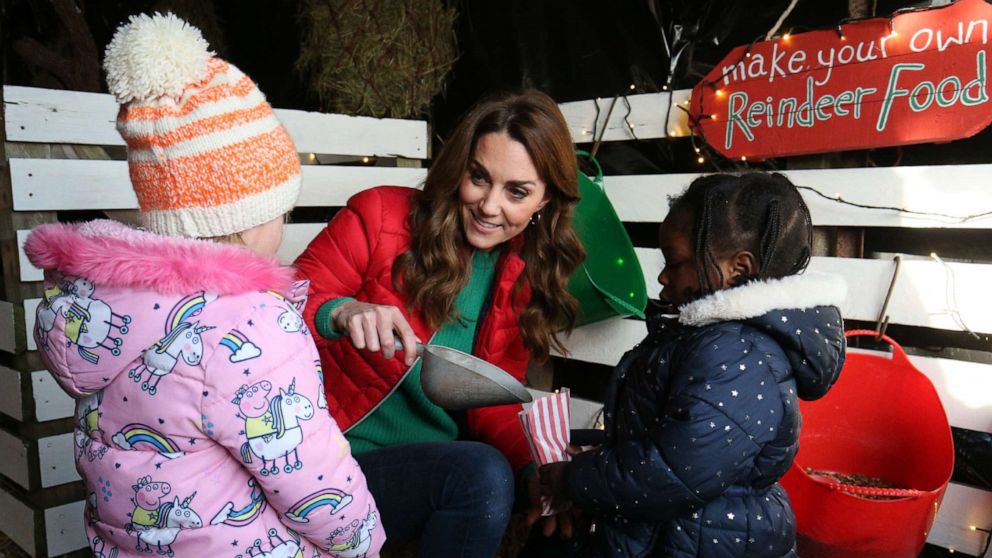 PHOTO: Catherine, Duchess of Cambridge hands out reindeer food to children during a visit to Peterley Manor Farm on Dec. 4, 2019 in Great Missenden, England.