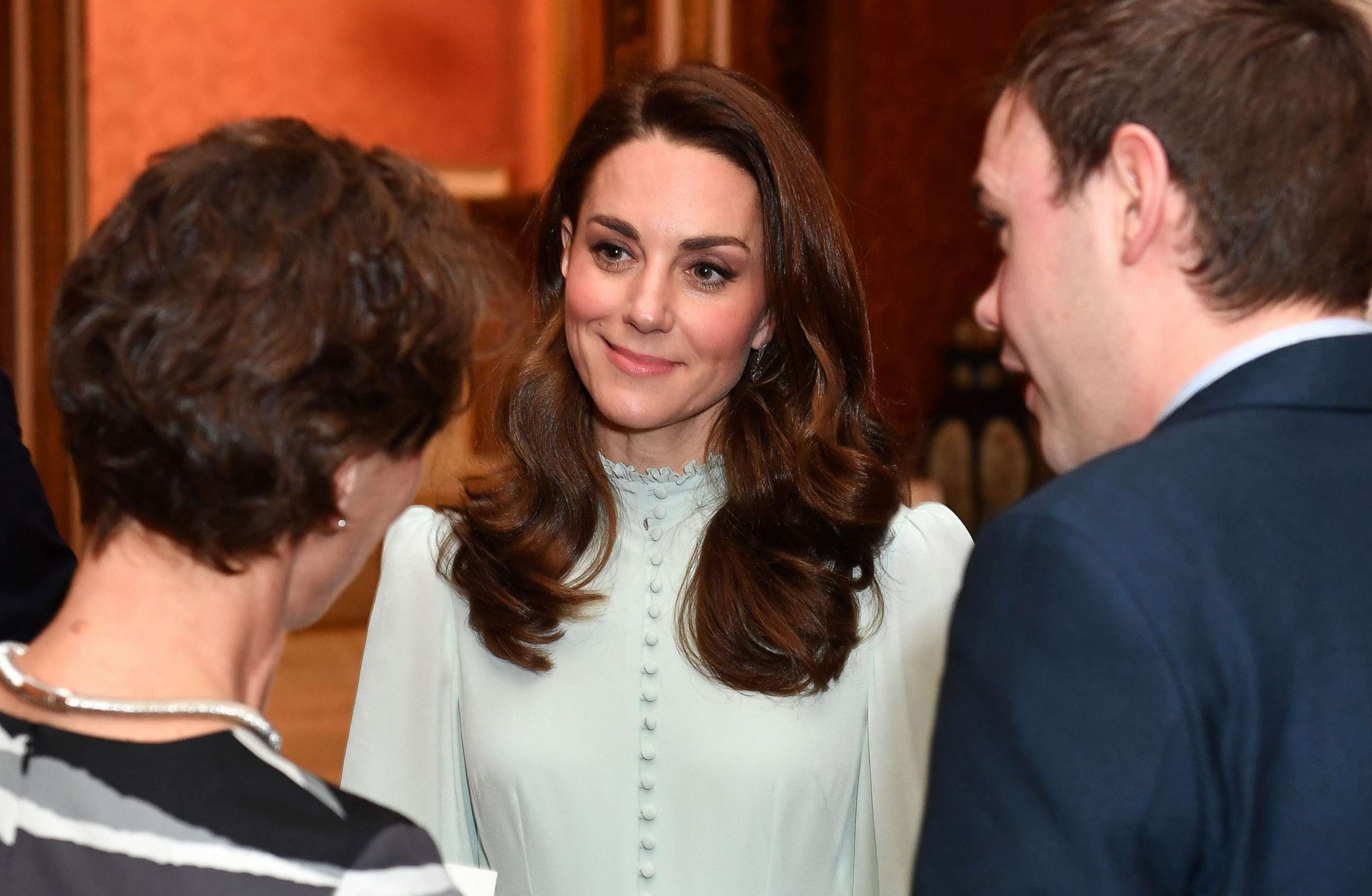 PHOTO: Catherine, Duchess of Cambridge, talks with guests as she attends a reception to mark the 50th Anniversary of the investiture of The Prince of Wales at Buckingham Palace in London, March 5, 2019.