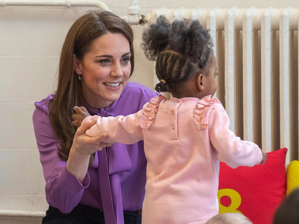 PHOTO: Britains Kate the Duchess of Cambridge, reacts with a child, during a visit to the Henry Fawcett Childrens Centre in Kennington, London, March 12, 2019.