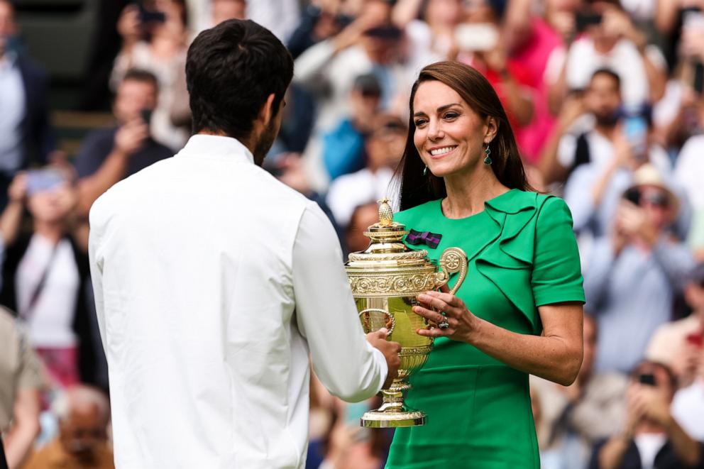 PHOTO: In this July 1, 2023 file photo Catherine, Princess of Wales gives the trophy to Carlos Alcaraz of Spain during the ceremony after winning the Men's Single Final Match during day fourteen of The Championships Wimbledon 2023 in London.