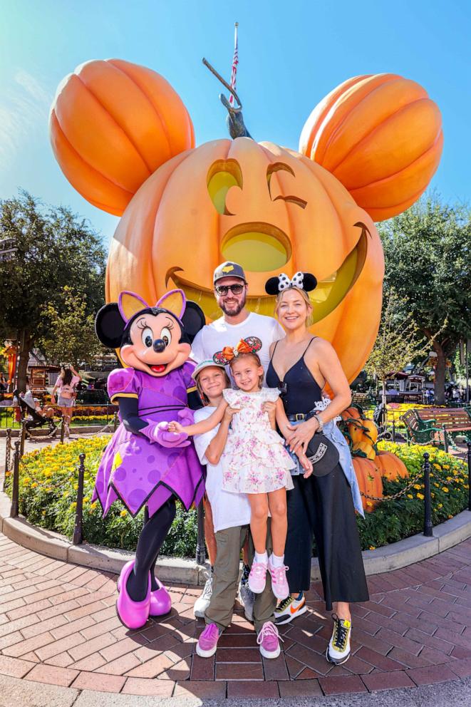 PHOTO: In this handout image provided by Disneyland Resort, actress Kate Hudson and her family celebrate her daughter Rani Rose's birthday with Minnie Mouse and son Bingham during Halloween Time at Disneyland Park on Sept. 26, 2022 in Anaheim.