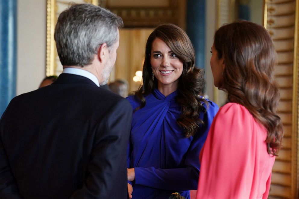 PHOTO: Catherine, Princess of Wales speaks talks with Mary, Crown Princess of Denmark and Crown Prince Frederik of Denmark during a reception at Buckingham Palace for overseas guests attending the coronation of King Charles III on May 5, 2023 in London.