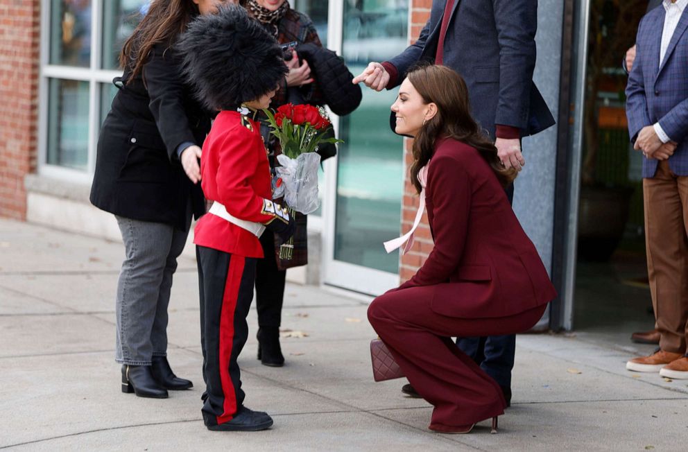 PHOTO: Henry Dynov-Teixeria, 8, presents flowers to Prince William and Kate, Princess of Wales, as his parents Melissa, left, and Irene, look on following a visit to Greentown Labs, Dec. 1, 2022, in Somerville, Mass.