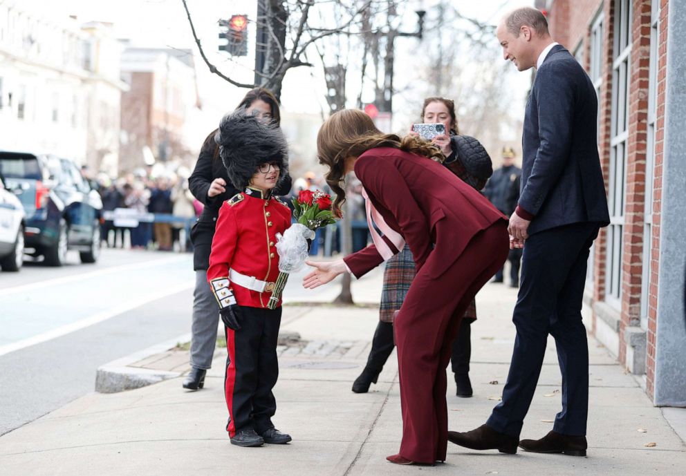 PHOTO: Henry Dynov-Teixeria, 8, presents flowers to Prince William and Kate, Princess of Wales, as his parents Melissa, left, and Irene, look on following a visit to Greentown Labs, Dec. 1, 2022, in Somerville, Mass.