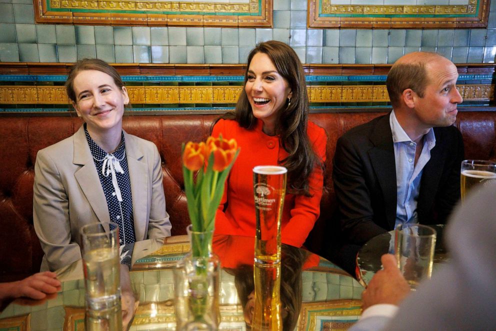 PHOTO: Prince William, Prince of Wales and Catherine, Princess of Wales chat to local business people as they visit the Dog and Duck pub in Soho ahead of this weekend's coronation on May 4, 2023 in London, England.