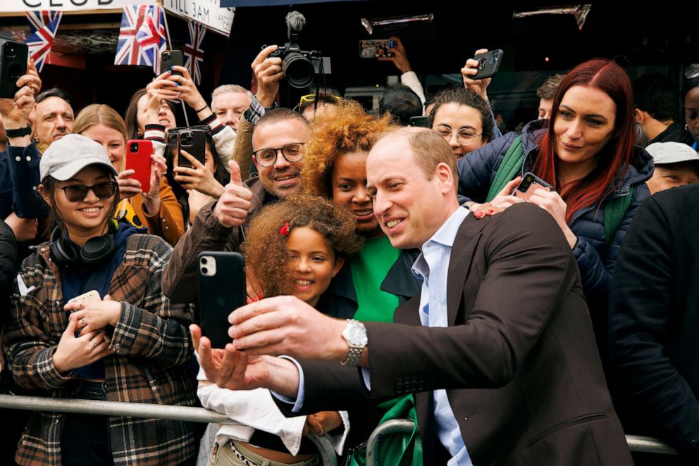 PHOTO: Prince William, Prince of Wales speaks to the gathered public during a walkabout outside the Dog and Duck pub in Soho ahead of this weekend's coronation on May 4, 2023 in London.