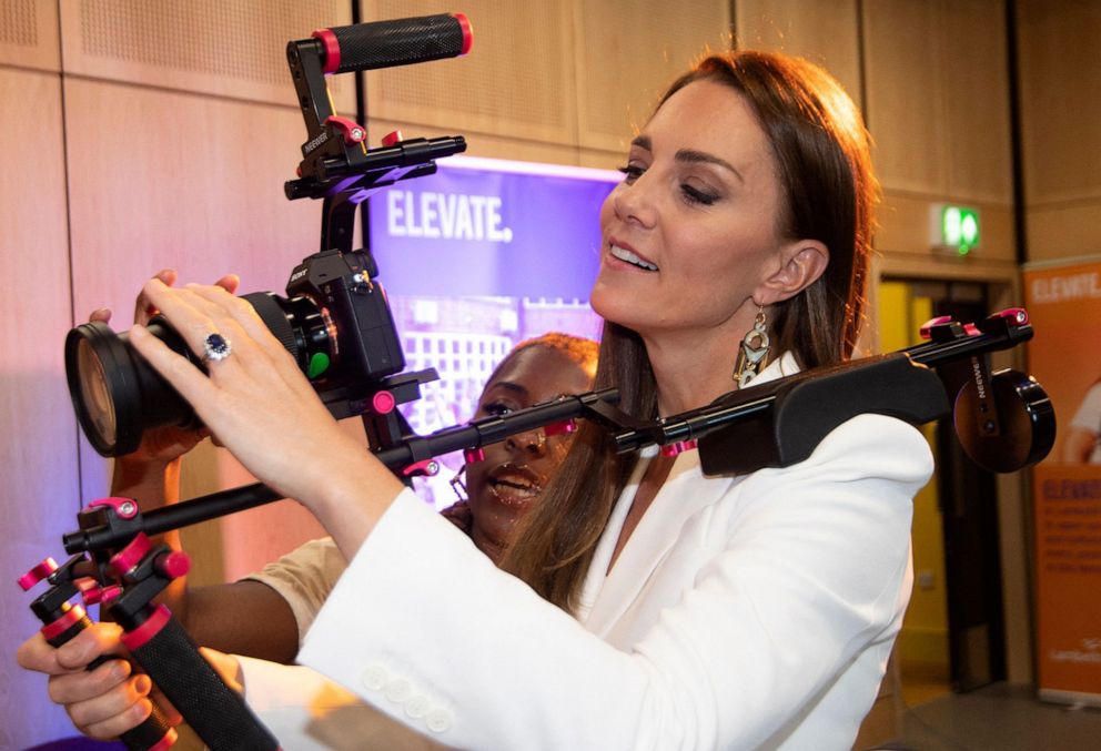 PHOTO: Catherine, Duchess of Cambridge uses a camera as she meets with members of the association ELEVATE, which focus on the creative and cultural sector for the young ones, at Brixton House, in London, June 22, 2022.