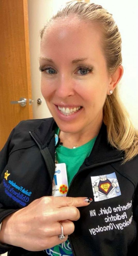 PHOTO: Katherine Quirk, a pediatric hematology/oncology nurse with Broward Health, poses after receiving a COVID-19 vaccine shot.