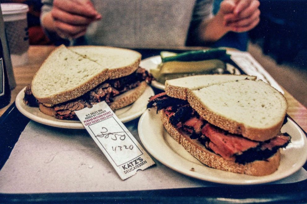 PHOTO: Pastrami on rye and brisket on rye sandwiches with a plate of pickles at Katz's Delicatessen in Manhattan.