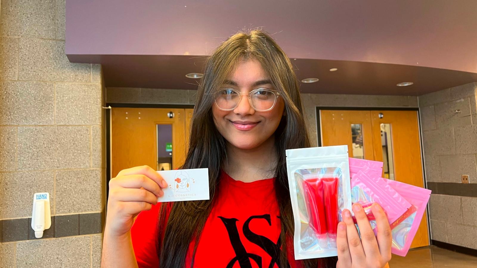 PHOTO: Kavya Odari poses with products from her cosmetics line "K.O. Cosmetics."