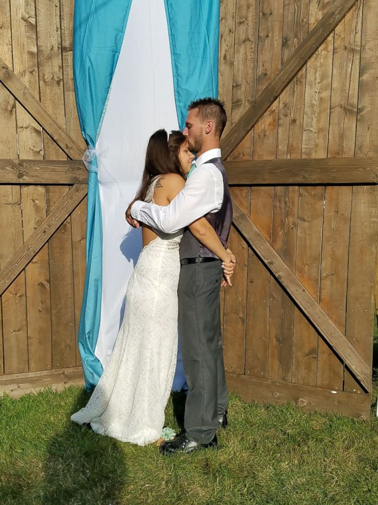 PHOTO: Kayla Roussin, 27, of Michigan, seen with her husband, Jonathan Roussin, on their wedding day.