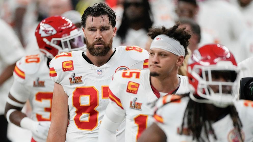 PHOTO: Kansas City Chiefs tight end Travis Kelce, quarterback Patrick Mahomes, and running back Kareem Hunt walk off the field at the halftime break during the NFL Super Bowl 59 football game against the Philadelphia Eagles, Feb. 9, 2025, in New Orleans. 