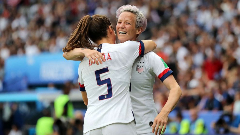 PHOTO: Megan Rapinoe of the USA celebrates with teammate Kelley O'hara after scoring her team's first goal during the 2019 FIFA Women's World Cup France Quarter Final match between France and USA at Parc des Princes, June 28, 2019 in Paris.