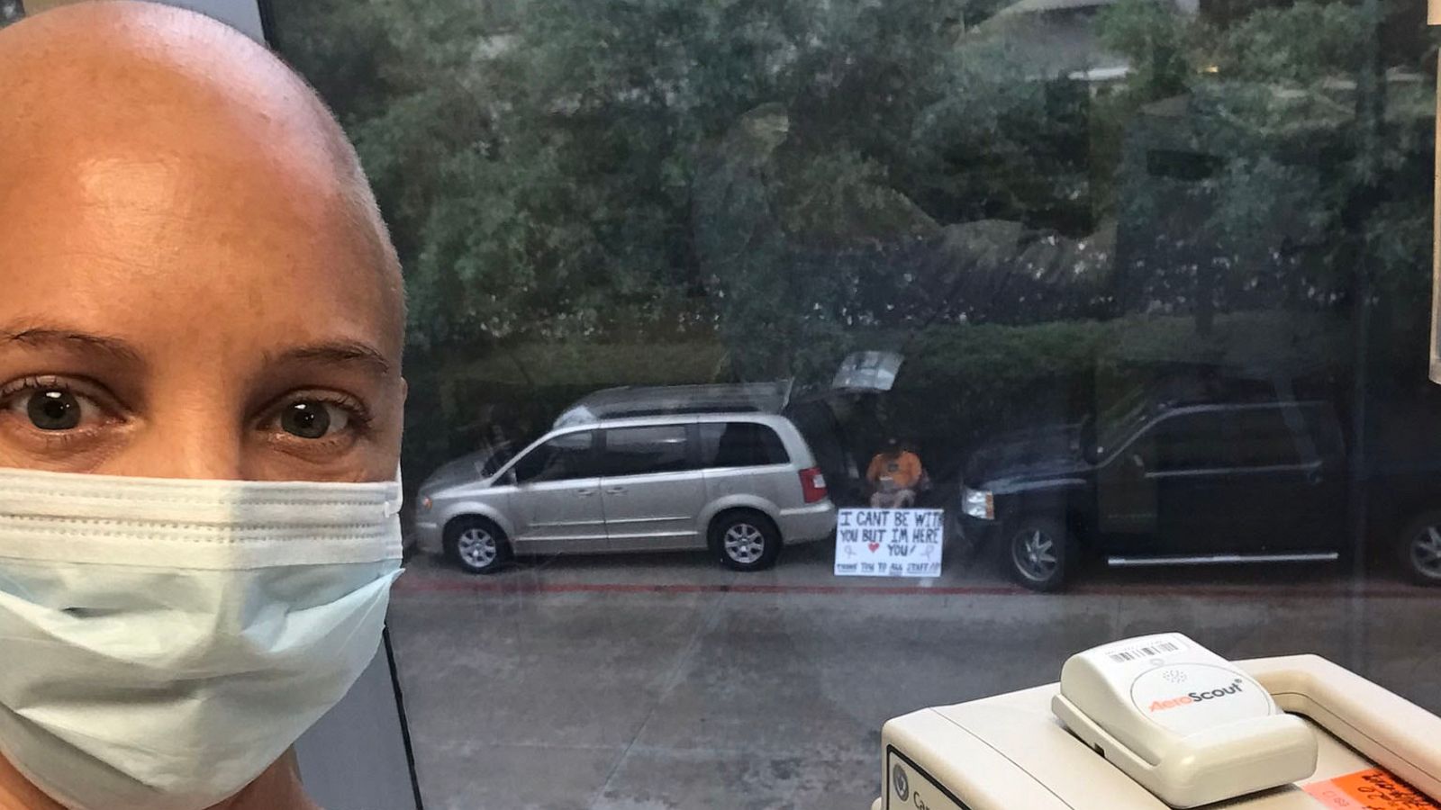 PHOTO: Kelly Conner takes a selfie with her husband Albert Conner in the background at the University of Texas MD Anderson Cancer Center in Sugar Land, Texas.