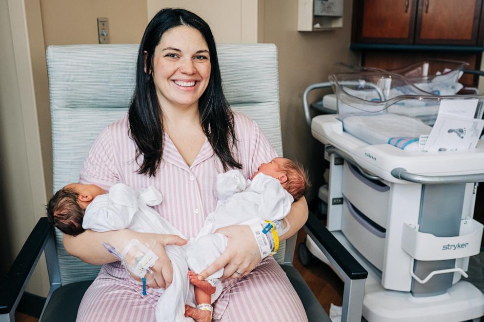 PHOTO: Kelsey Hatcher holds her twin daughters Roxi Layla (L) and Rebel Laken (R), Dec. 21, 2023, at the University of Alabama at Birmingham.