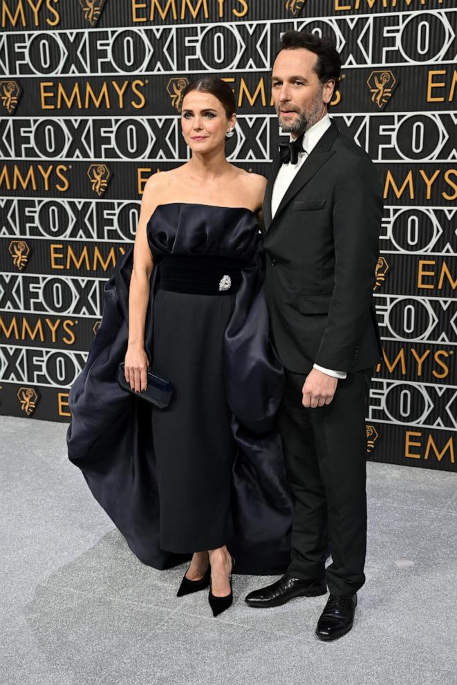 PHOTO: US actress Keri Russell (L) and partner Matthew Rhys arrive for the 75th Emmy Awards at the Peacock Theatre at L.A. Live in Los Angeles on Jan. 15, 2024.