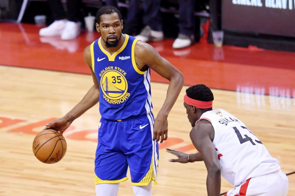 PHOTO: Golden State Warriors forward Kevin Durant (35) dribbles in front of Toronto Raptors forward Pascal Siakam (43) during the second quarter in game five of the 2019 NBA Finals at Scotiabank Arena, June 10, 2019, in Toronto.