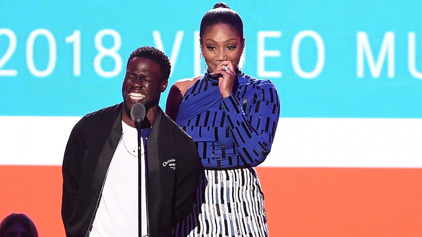 PHOTO: Kevin Hart and Tiffany Haddish speak onstage during the 2018 MTV Video Music Awards at Radio City Music Hall in New York City, Aug. 20, 2018.