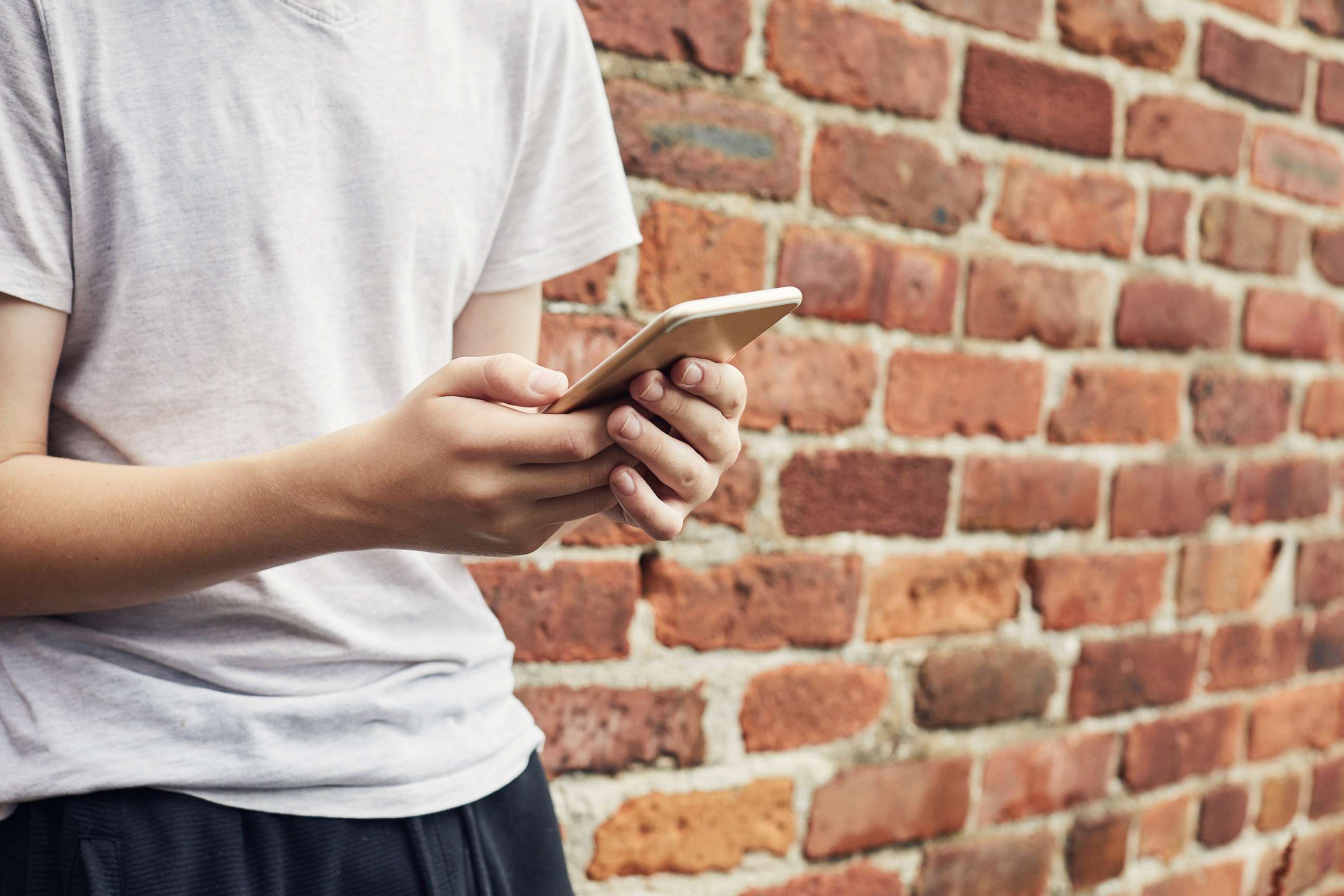 PHOTO: A young person is depicted using a cell phone in an undated stock photo.