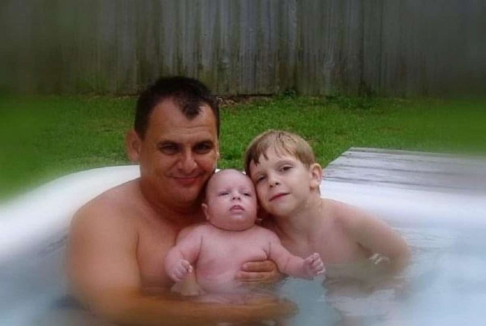 PHOTO: Bryan Herrington poses with his two children before his death in 2004.