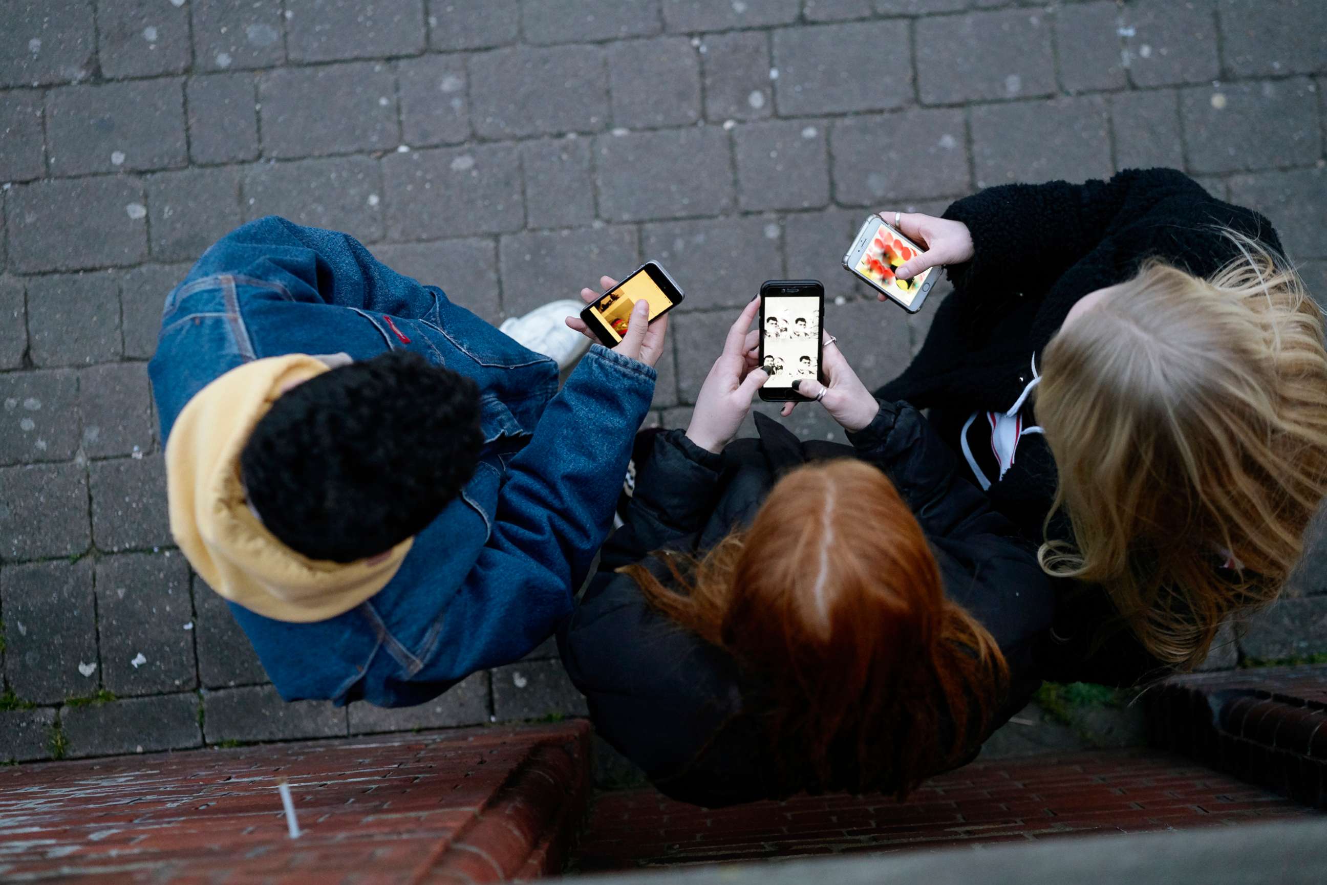 PHOTO: Young people on cell phones. 