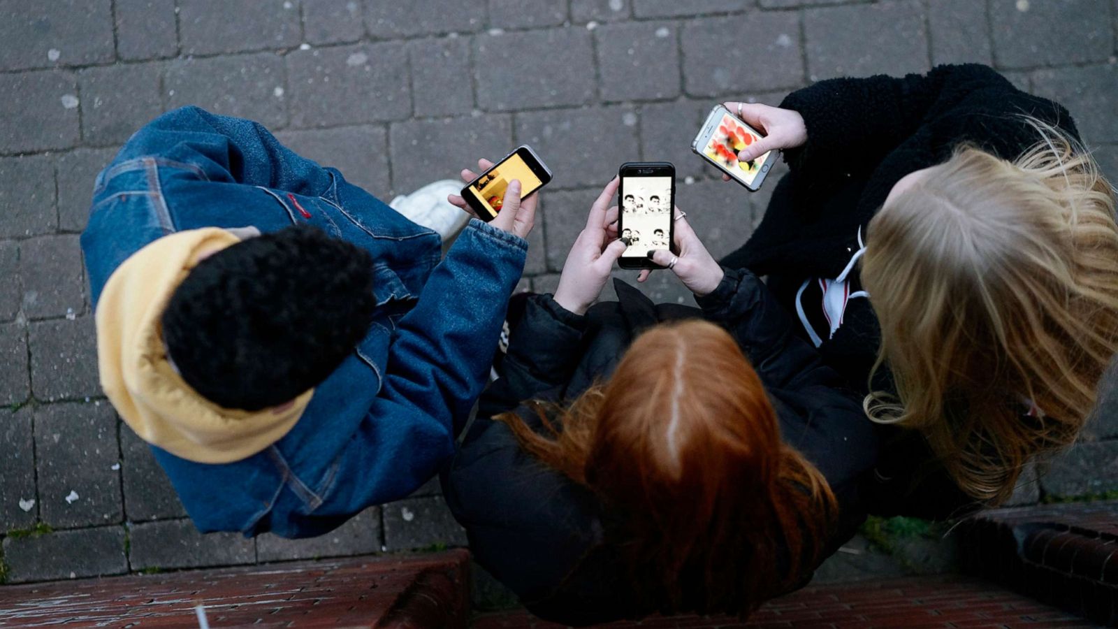 PHOTO: Young people on cell phones.